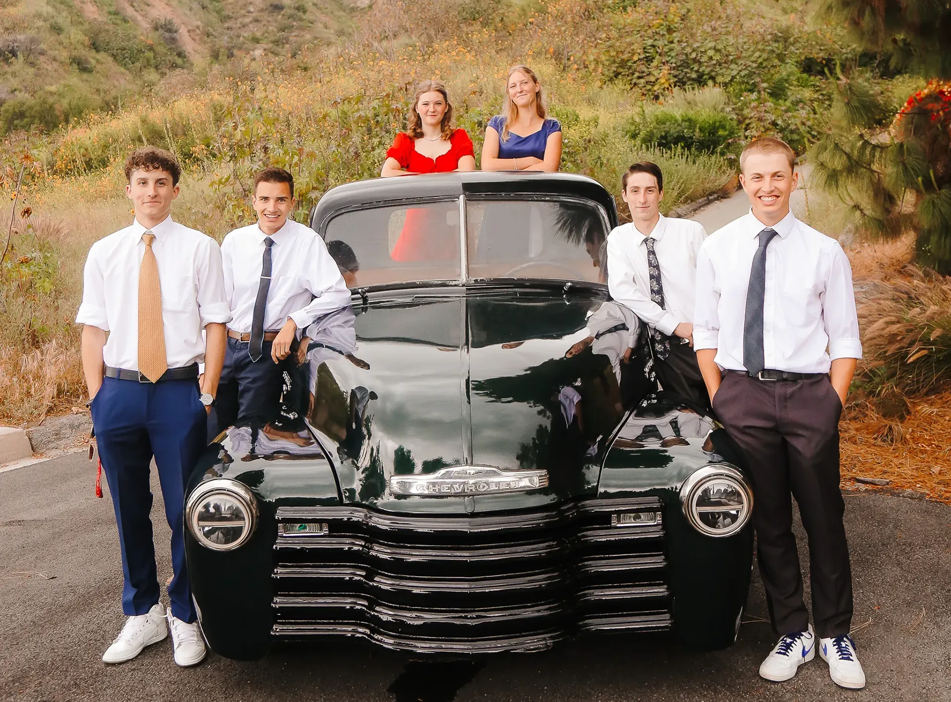 Prom portrait near an old truck