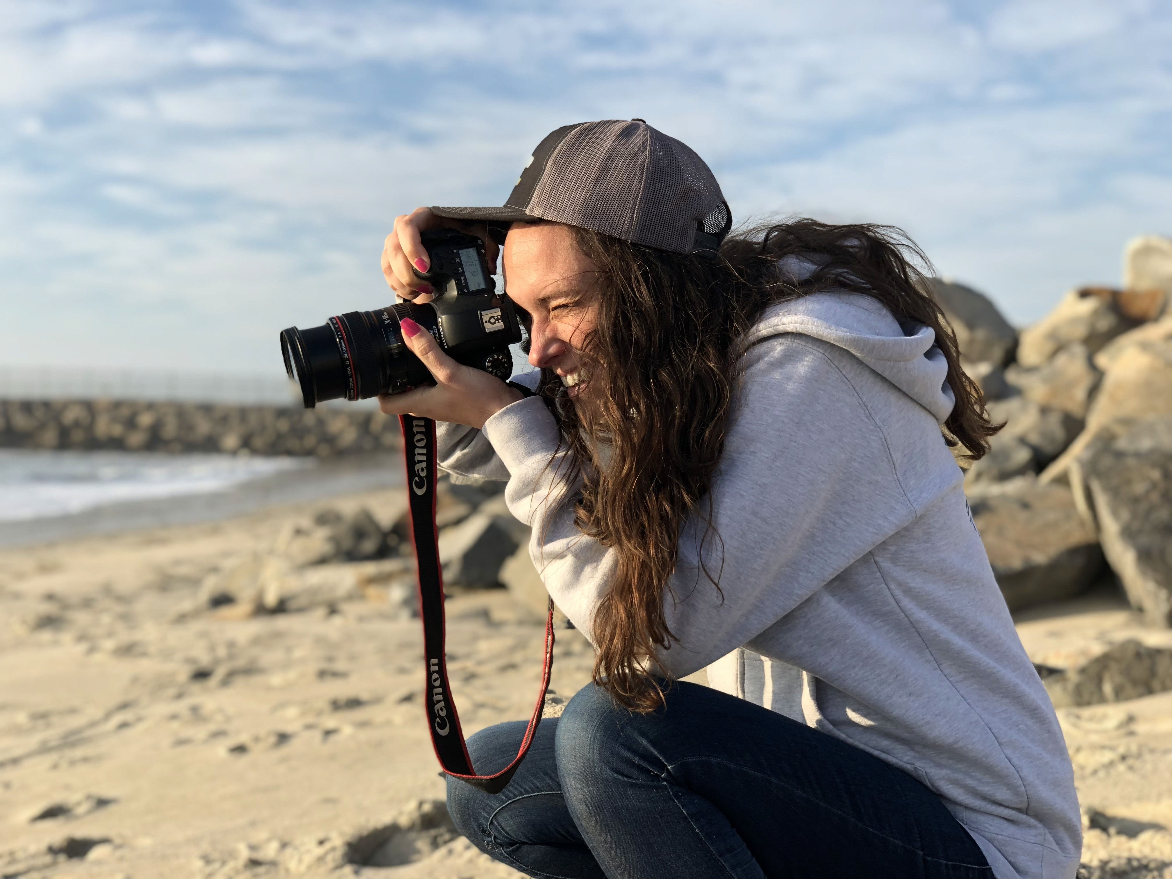 Hillary photographing at the beach